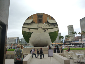 Sky Mirror 2006 by Anish Kapoor enjoyed from the back by tourists in Sydney